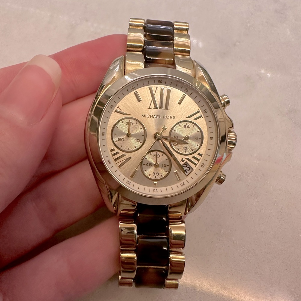Michael Kors women’s tortoise shell gold watch